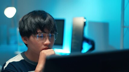 Programmer focusing monitor software backend development system interface coding task engineer technology solution