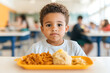 © photo for everything - Young boy at school lunch.  A focused look before eating. The yellow tray makes the meal inviting. Nourishing children one meal at a time.