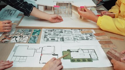 Poster - A dynamic architectural planning session showcasing diverse hands collaborating on sketches and models, emphasizing creativity and teamwork in building design projects. SACTR
