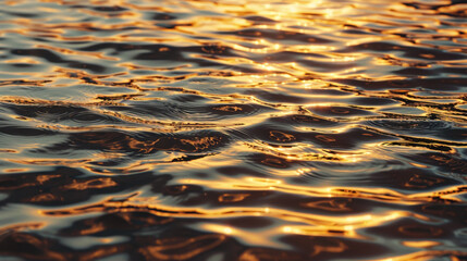 Poster - Rippling water texture under sunlight creates mesmerizing reflection, showcasing beauty of nature patterns and colors. warm tones evoke sense of tranquility and peace