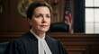 © Raden - Serious Female Judge in Courtroom Wearing Robes and Bands