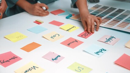 Poster - A dynamic group of professionals engages in creative collaboration, utilizing colorful sticky notes and markers to develop innovative strategies during a brainstorming session. SACTR