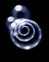 Poster - Artistic water bubbles spiral pattern abstract clear glossy round modern black background creative