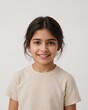 © Arceli - South Asian girl wearing plain soft beige tshirt smiling happy portrait on plain white background