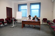 © Vasyl - Two business women work in the office to solve problems and sign agreements.