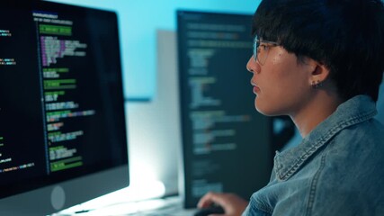 Software developer using keyboard debugging code task programming system dual monitor screen focus logic