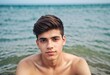 © PNG&Background Image - Portrait of a young man sitting in the sea with copy space