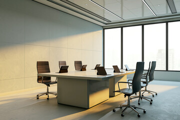 Poster - Modern corporate boardroom interior with sleek furniture, laptops on desk, large windows and sunlight casting shadows across the office space. 3D Rendering