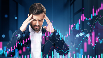 Poster - Stressed businessman overwhelmed by financial market data with holographic stock charts overlayed on office background at night.