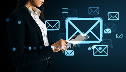 Poster - Businesswoman using a tablet with floating email icons on dark background representing digital communication and online messaging technology.