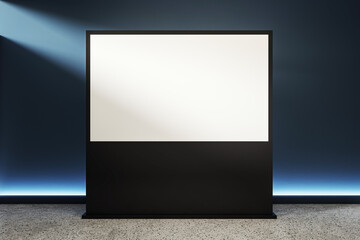 Poster - Blank lightbox display stand with black frame in dark modern interior illuminated by spotlights on concrete floor for advertising presentation mockup. 3D Rendering