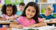 © Atelier d’Alya - Happy students writing in classroom during lesson at school