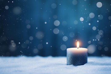 Poster - Glittery candle burning in snow during winter night creating a warm and magical atmosphere