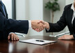 © laxe - business people shaking hands background