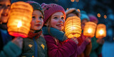 Joyful children singing traditional songs while carrying glowing lanterns during a St. Martin's Day night walk, surrounded by families and warm community spirit. Banner with copy space