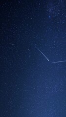 Wall Mural - a mesmerizing video still of a starry night sky, captured from a low-angle perspective, showcasing c