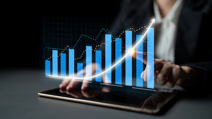 Poster - A professional hand interacts with a digital graph on a tablet screen, illustrating financial growth trends in a modern office setting, emphasizing data insights. Impute