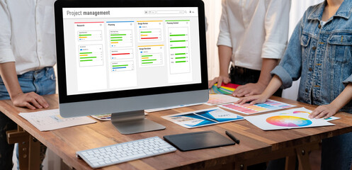 Poster - Project planning software for brisk business project management on the computer screen showing timeline chart of the team project