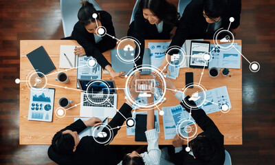 Poster - A diverse group of professionals engages in a collaborative business meeting, focusing on data analysis and strategic planning while utilizing modern technology and visual aids. Amity