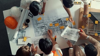 Poster - Top down view of skilled engineer team talking about house construction. Aerial view of group of architect or designer discussing and writing sticky note to brainstorm about blueprint. Alimentation.