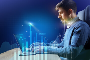 Poster - Business professional analyzes data trends while working on laptop in modern office setting at night