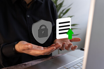 Poster - Close-up of a businessman working on his computer with 3D icons of a shield with padlocks and a document with an arrow. Concept of security for documents uploaded to the cloud.