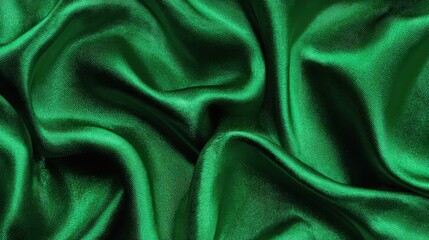 Poster - Soft green satin fabric lays elegantly, displaying its smooth texture and sheen. The waves in the fabric create a visually appealing depth and richness.