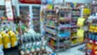 © Aditiya - Abstract defocused background of a minimarket or convenience store. Blurred minimarket shop
