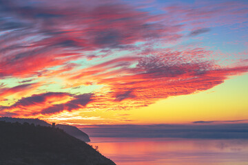 Wall Mural - Seascape during a colorful sunrise. Beautiful sunrise over the mountains. Balcon De Maro, Maro, Malaga, Spain, Europe