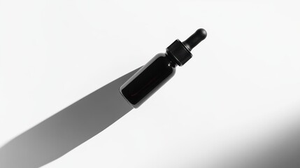 Poster - Dark-colored glass bottle with dropper in minimalist studio setting