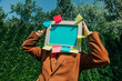 © VISTA by Westend61 - Retro monitor on person?s head as digital identity visual metaphor outdoors
