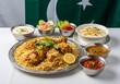 © Animal - Savor authentic Pakistani chicken biryani with vibrant side dishes, a culinary delight celebrating flavor and tradition.