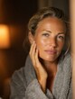 © ai_katrin - a woman standing in front of a mirror, examines face for wrinkles