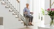 © Chainarong - Cheerful senior woman using a modern stairlift at home for mobility and independence