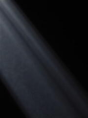 Wall Mural - dark gray fabric subtle diagonal pinstripes illuminated soft overhead light emphasizing texture pattern