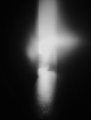 Poster - A Bright Light Illuminating a Dark Space, Evoking Mystery and Intrigue. The image features a stark contrast between light and shadow, creating a captivating and enigmatic visual experience.