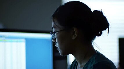 Woman Coding Late Night Focused on Computer Screen