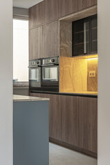 Poster - Modern kitchen with multifunctional island: dining space, smart storage, and state-of-the-art appliances.