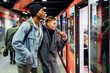 © TrueShot | Westend61 - Young couple at the station platform entering subway