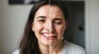 © Таня Андреева - Split screen portrait of young woman showing contrasting emotions - happy smiling on left side, sad crying on right. Mental health, mood, and emotional wellness concept.