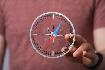 Poster - A man interacts with a digital compass, illustrating navigation, direction, and exploration.