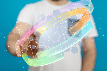 Poster - Stock photo of a person interacting with a holographic 3D data visualization interface.
