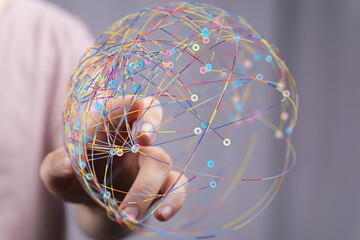 Poster - Abstract image of a hand interacting with a colorful global network, representing connection and communication.
