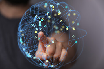 Poster - Person interacts with a digital network, representing global connection and data interaction.