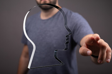 Poster - A man interacts with a transparent head outline, symbolizing mind, thought, idea, or mental health.