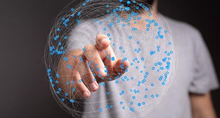Poster - Hand pointing at a digital sphere representing global connections and data.