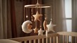 © Alice - A crib with a crib mobile featuring stars and crescents on the sides