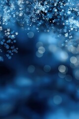 Winter snowflakes and bokeh lights on dark blue background