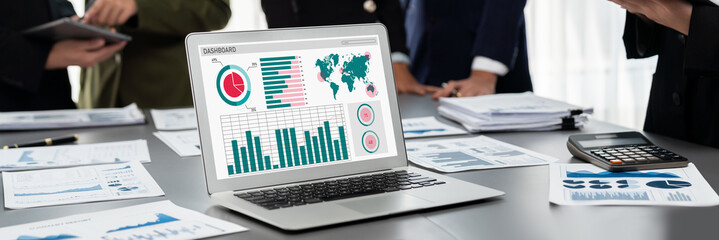 Poster - Panorama shot analyst team utilizing BI Fintech to analyze financial report with laptop. Businesspeople analyzing BI data dashboard displayed on laptop screen for business insight. Prodigy