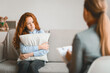 © Prostock-studio - Teenage Depression Concept. Female child psychologist working with sad girl in office or at home, stressed teenager talking about family problems, feeling anxiety, sitting on sofa, hugging pillow